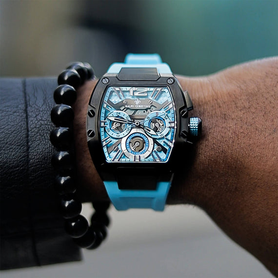 The Intrepid Sport - Arctic Blue men's luxury watch featuring a blue dial with 24-hour subdial, day and date functions, black case, and matching blue strap, bold by design.