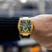 The Intrepid Sport - Gilded Black men's luxury watch with a gold-tone case, black dial featuring 24-hour, day, and date subdials, and a black rubber strap, bold by design.