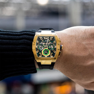 The Intrepid Sport - Gilded Black men's luxury watch with a gold-tone case, black dial featuring 24-hour, day, and date subdials, and a black rubber strap, bold by design.