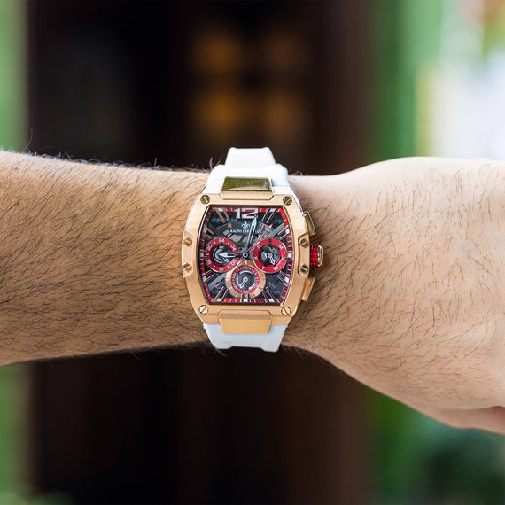 The Intrepid Sport - Ice White men's luxury watch with a bold rose gold case, black and red dial featuring chronograph subdials, and a white strap, worn on wrist, bold by design.