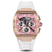 Rose gold statement watch with a pink chronograph dial, three subdials, exposed screws, and a white rubber strap.
