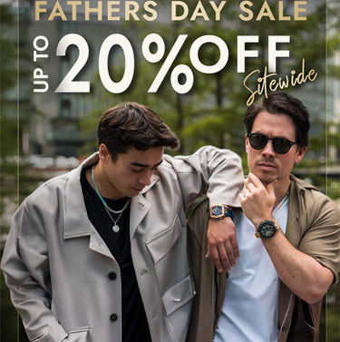 Two men outdoors wearing stylish watches and casual jackets, one with dark hair looking down and the other wearing sunglasses looking forward, with a green natural background and a bold red 