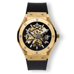Prague Skeleton Automatic Deluxe - Gold men's luxury watch with gold case, exposed skeleton dial, silver-tone hands, and black textured strap, bold by design.