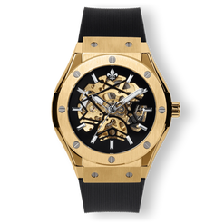 Prague Skeleton Automatic Deluxe - Gold men's luxury watch with gold case, exposed skeleton dial, silver-tone hands, and black textured strap, bold by design.
