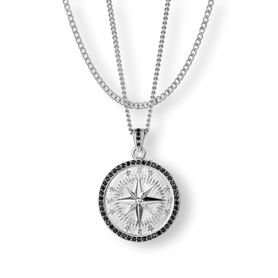 The Compass Essentials Bundle - Silver features a bold silver compass pendant with black cubic zirconia accents on a matching silver chain necklace, designed for men's jewelry.