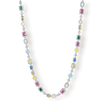 The Gemstone Necklace featuring a delicate silver chain adorned with colorful cubic zirconia gemstones in various shapes and vibrant hues, designed to make a bold statement.