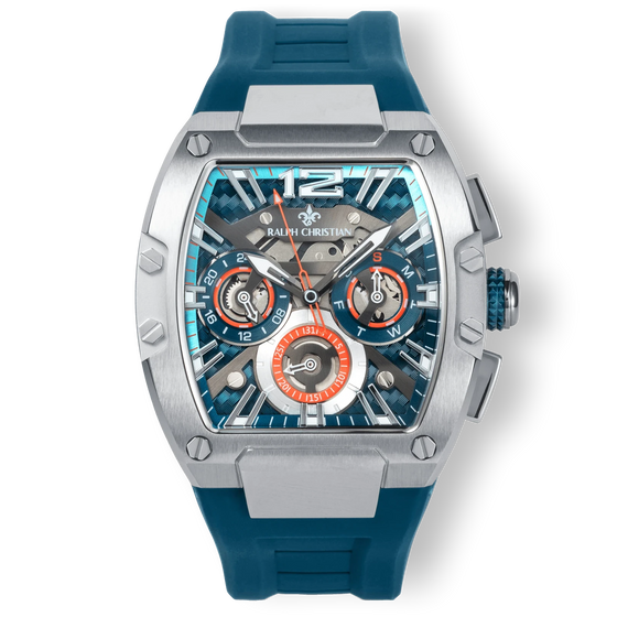 The Intrepid Sport - Blue Horizon men's luxury watch featuring a blue rubber strap, bold stainless steel case, sapphire-coated crystal, and intricate chronograph subdials with orange accents, designed to be noticed. Bold by Design.
