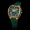 A luxury watch with a gold-tone rectangular case, a dark dial featuring green subdials and luminous markers, and a dark green silicone strap, shown against a solid black background.
