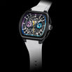 A luxury wristwatch with a black square case, skeleton dial showing intricate inner mechanics, and a white silicone strap, set against a solid black background.