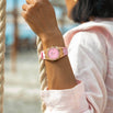 The Celeste - Rose Blush women's luxury watch with a pink dial, rose gold case, and pink strap, styled boldly for a standout statement look.