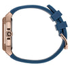 Watch with blue strap and rose gold case on a white background