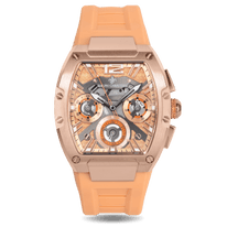 Luxury watch with rose gold case and peach silicone strap on a white background