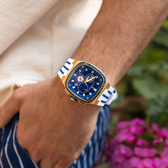 The Legacy Chrono Ice - Sapphire Royale men's luxury watch with a blue dial, gold-tone case, white and blue strap, chronograph subdials, and sapphire-coated crystal on wrist, bold by design.