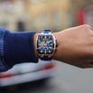 Close-up of The Polaris Chrono - Royal Blue luxury men's watch on wrist, featuring a bold royal blue dial with chronograph subdials, rose gold case, and matching blue strap, showcasing Ralph Christian’s bold by design statement watch.
