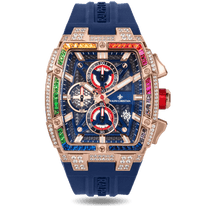 The Polaris Chrono Ice - Celestial Nova men's luxury watch features a rose gold-tone case with a rainbow gradient of cubic zirconia stones set on the bezel, a deep blue textured dial with red and white chronograph subdials, date function, and a blue silicone strap, combining bold design and statement watch craftsmanship.