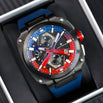 Luxury watch with blue and red accents on a dark background