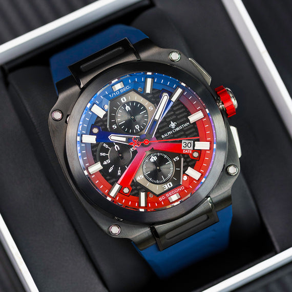 Luxury watch with blue and red accents on a dark background