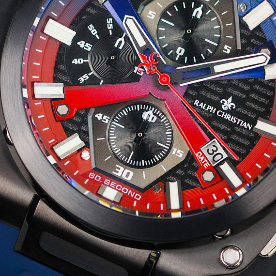 Close-up of a Ralph Christian watch with red and blue accents