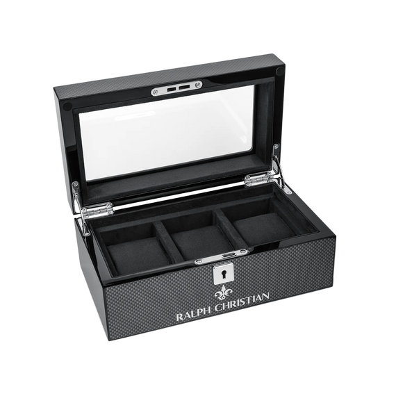 Luxury Collectors Watch Case by Ralph Christian featuring carbon fiber texture, black interior with three compartments, glass top display, and secure lock closure.